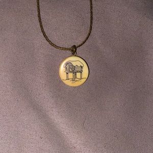 Gold necklace with house decal